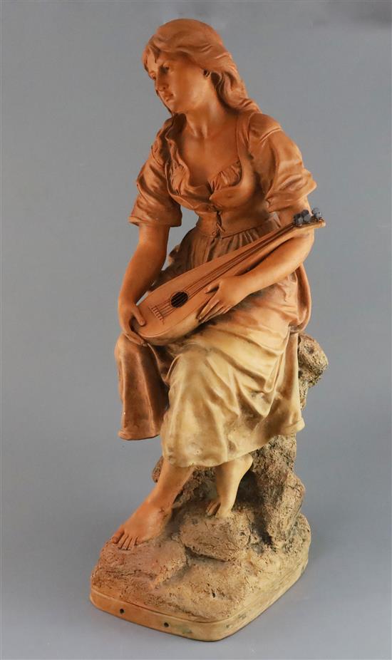 Joseph Le Guluche (1849-1915). A terracotta figure of a seated lady mandolin player, 22.5in.